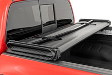 Load image into Gallery viewer, Soft Tri-Fold Bed Cover 5 Foot Bed Nissan Frontier 2WD/4WD (2022-2026) Rough Country