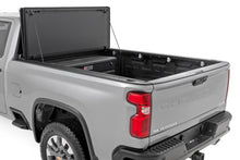 Load image into Gallery viewer, Hard Tri-Fold Flip Up Bed Cover 6 Foot 9 Inch Bed Chevy/GMC Silverado/Sierra 2500HD/3500HD (20-26) Rough Country