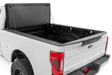 Load image into Gallery viewer, Hard Tri-Fold Flip Up Bed Cover 6 Foot 10 Inch Bed Ford F-250/F-350 Super Duty (17-26) Rough Country