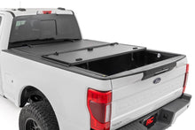 Load image into Gallery viewer, Hard Tri-Fold Flip Up Bed Cover 6 Foot 10 Inch Bed Ford F-250/F-350 Super Duty (17-26) Rough Country