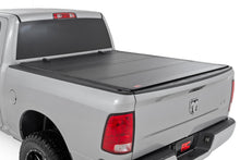 Load image into Gallery viewer, Hard Tri-Fold Flip Up Bed Cover 6 Foot 4 Inch Bed Ram 1500/2500/3500 (10-25 &amp; Classic) Rough Country