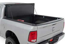 Load image into Gallery viewer, Hard Tri-Fold Flip Up Bed Cover 6 Foot 4 Inch Bed Ram 1500/2500/3500 (10-25 &amp; Classic) Rough Country