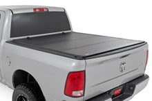 Load image into Gallery viewer, Hard Tri-Fold Flip Up Bed Cover 5 Foot 7 Inch Bed Ram 1500 2WD/4WD (2009-2018 &amp; Classic) Rough Country