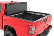 Load image into Gallery viewer, Hard Tri-Fold Flip Up Bed Cover 5 Foot Bed Nissan Frontier 2WD/4WD (22-26) Rough Country