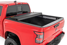 Load image into Gallery viewer, Hard Tri-Fold Flip Up Bed Cover 5 Foot Bed Nissan Frontier 2WD/4WD (22-26) Rough Country
