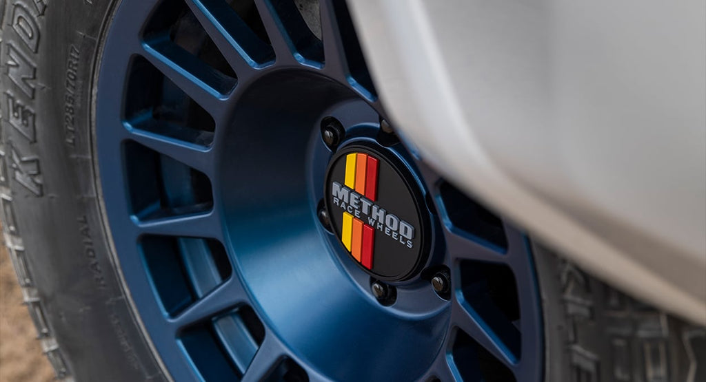 Method Wheels Push Through Center Cap | 108mm | Black with Yellow / Orange / Red Stripes