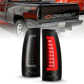 ANZO 1999-2000 Cadillac Escalade Luces traseras LED Par de lentes ahumados con carcasa negra
