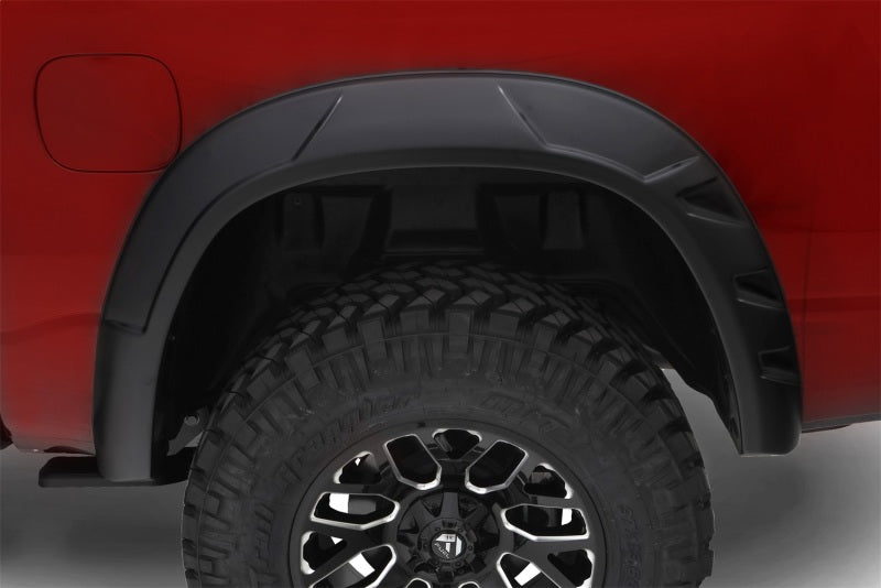 Bushwacker 09-18 Ram 1500 con caja Fleetside de 67.4 pulgadas (Ex. R/T y Rebel) DRT Style Flares 4 piezas - Negro