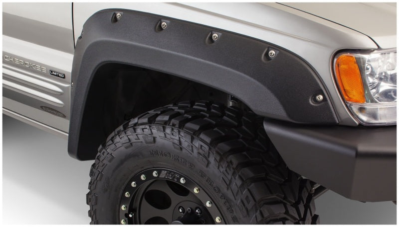 Bushwacker 99-04 Jeep Grand Cherokee bengalas estilo recortado 2 piezas - negro