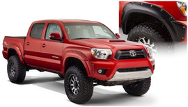 Bushwacker 12-15 Toyota Tacoma Fleetside Pocket Style Flares 4 piezas Cama de 60.3 pulgadas - Negro