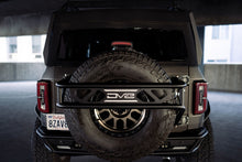 Cargar imagen en el visor de la galería, DV8 Offroad 21-23 Ford Bronco Protector de llanta de repuesto y soporte para accesorios
