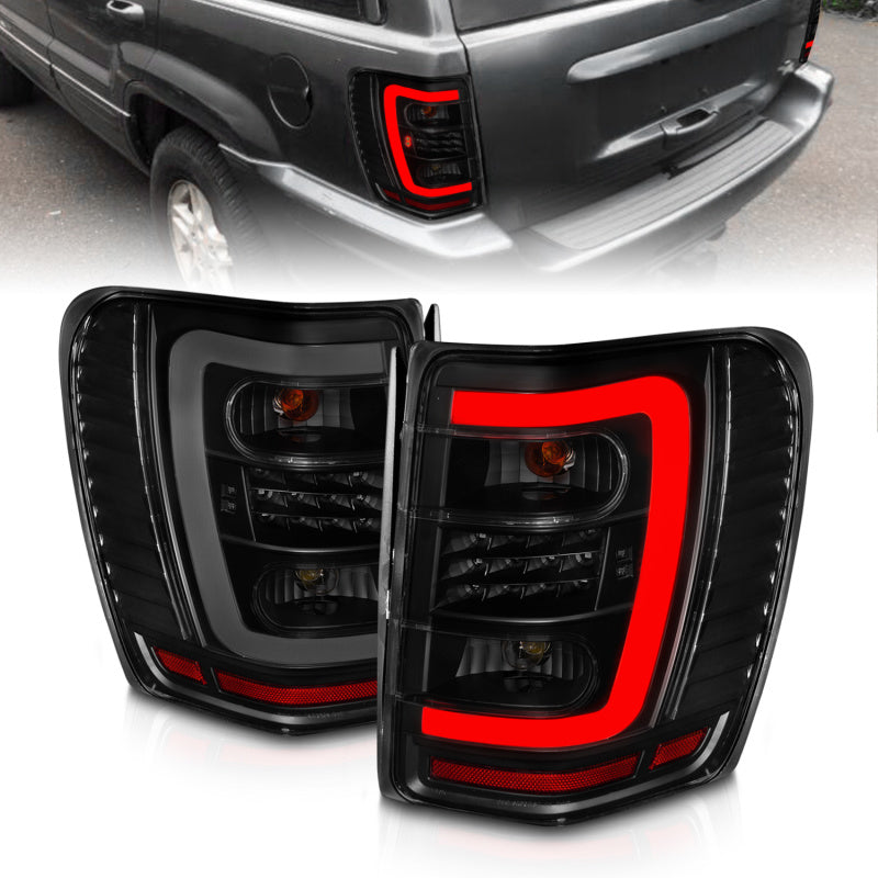 ANZO 1999-2004 Jeep Grand Cherokee luces traseras LED con barra de luz, carcasa negra, lente ahumada