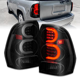 ANZO 2002-2009 Chevrolet Trailblazer luces traseras LED con barra de luz, carcasa negra, lente ahumada