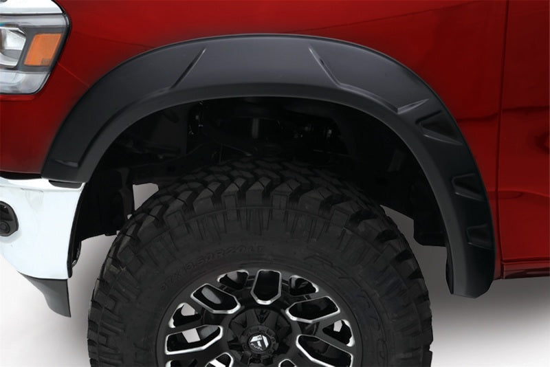 Bushwacker 09-18 Ram 1500 con caja Fleetside de 67.4 pulgadas (Ex. R/T y Rebel) DRT Style Flares 4 piezas - Negro