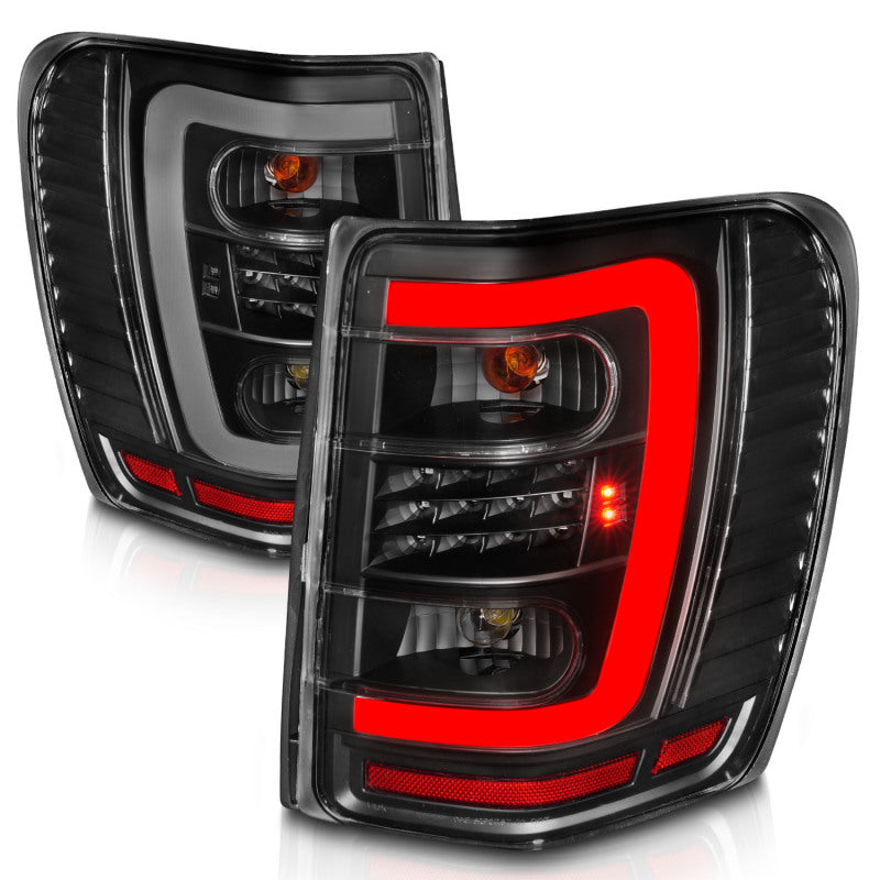 ANZO 1999-2004 Jeep Grand Cherokee luces traseras LED con barra de luz, carcasa negra, lente transparente