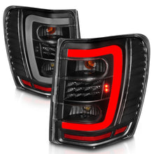 Cargar imagen en el visor de la galería, ANZO 1999-2004 Jeep Grand Cherokee luces traseras LED con barra de luz, carcasa negra, lente transparente